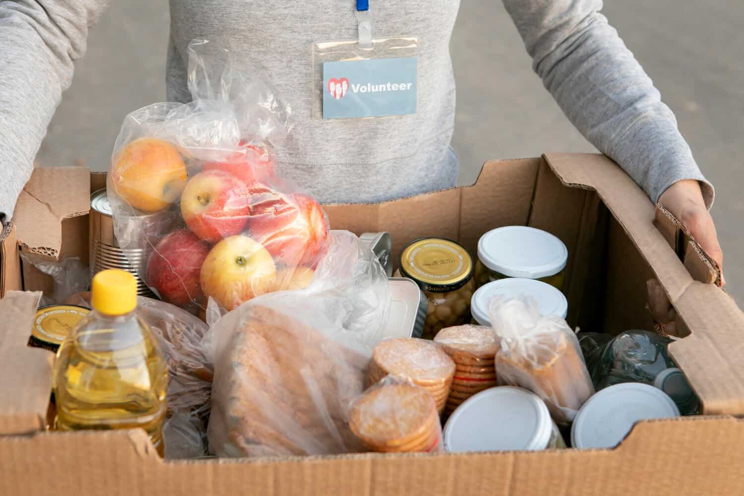 close-up-man-holding-box-with-food